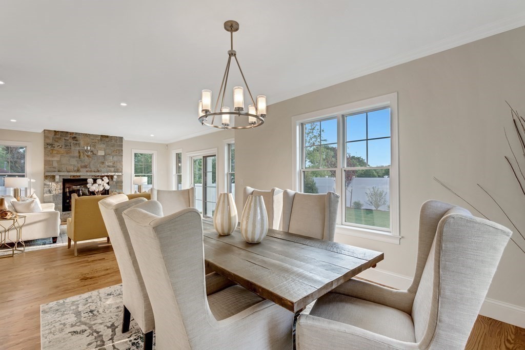 185 Hillside Avenue, Unit 185 Needham, MA 02494 - Photo 5 of 32 a view of a dining room with furniture window and wooden floor