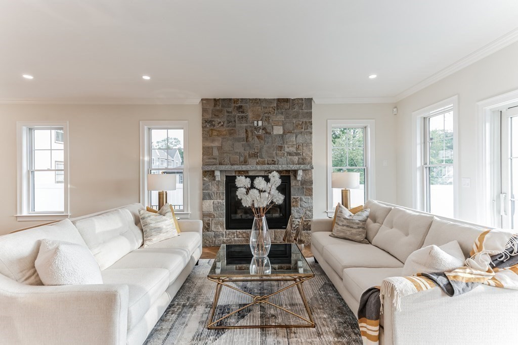 185 Hillside Avenue, Unit 185 Needham, MA 02494 - Photo 7 of 32 a living room with furniture and a large window