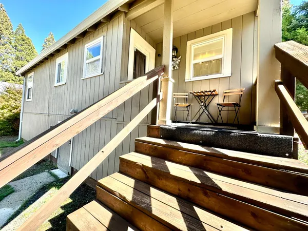 a view of balcony with furniture