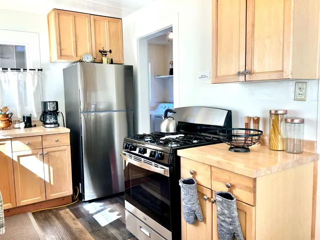 a kitchen with a stove a refrigerator and a stove