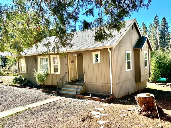 a front view of a house with a yard
