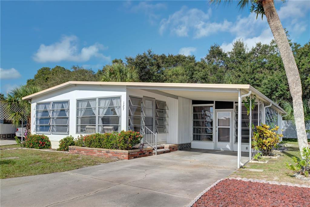 127 Roma Road Venice, FL 34285 - Photo 1 of 1 Front of home. You can see two Florida Rooms, one on front of home and one on the Side.
