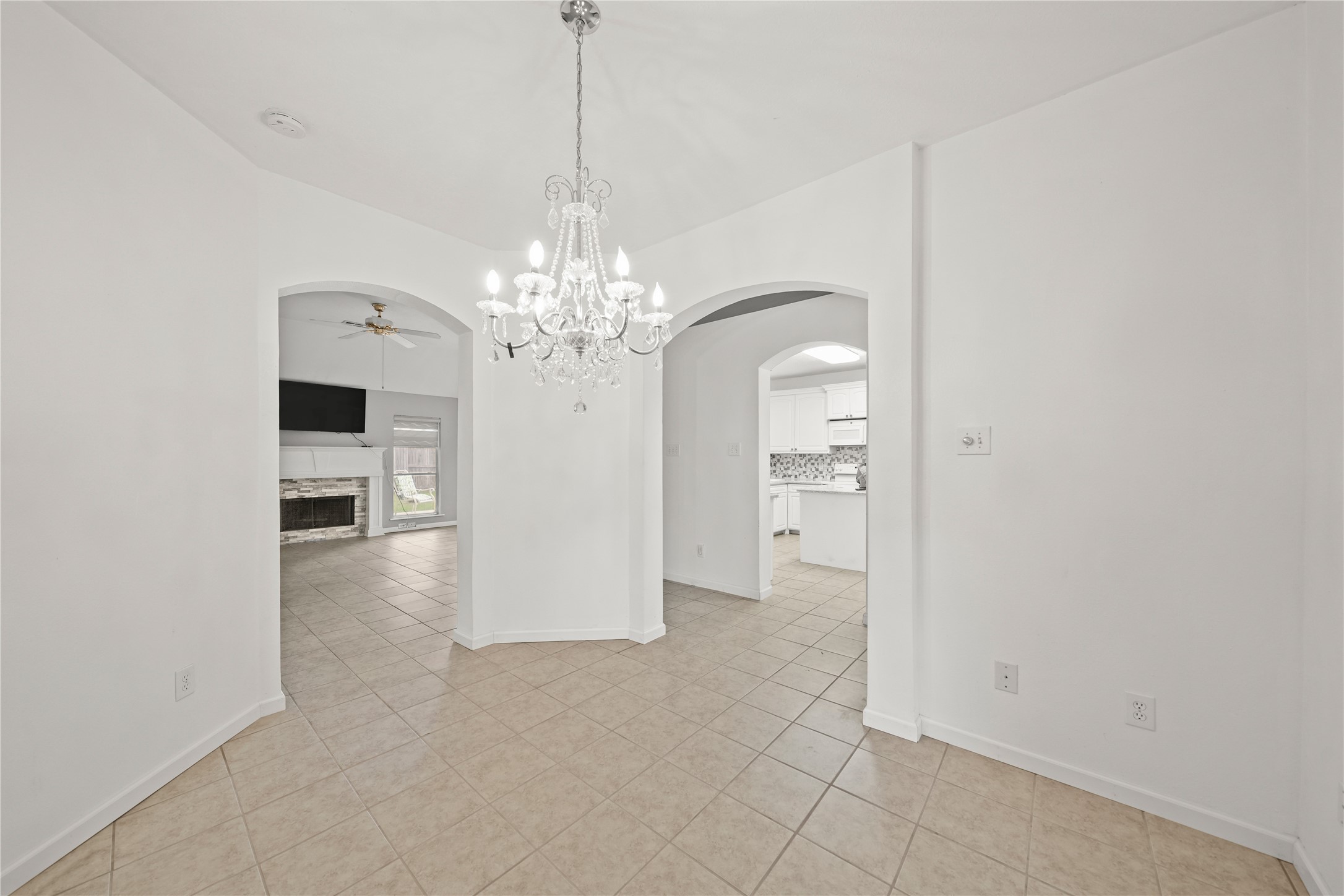 8134 Blue Jay Street Baytown, TX 77523 - Photo 15 of 31 a view of a hallway with chandelier and livingroom