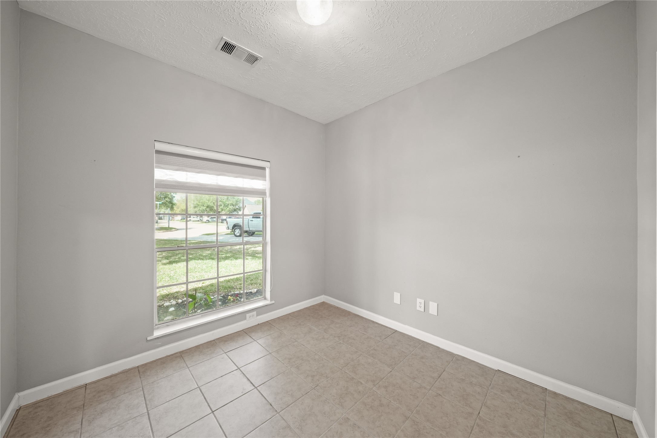8134 Blue Jay Street Baytown, TX 77523 - Photo 23 of 31 an empty room with windows