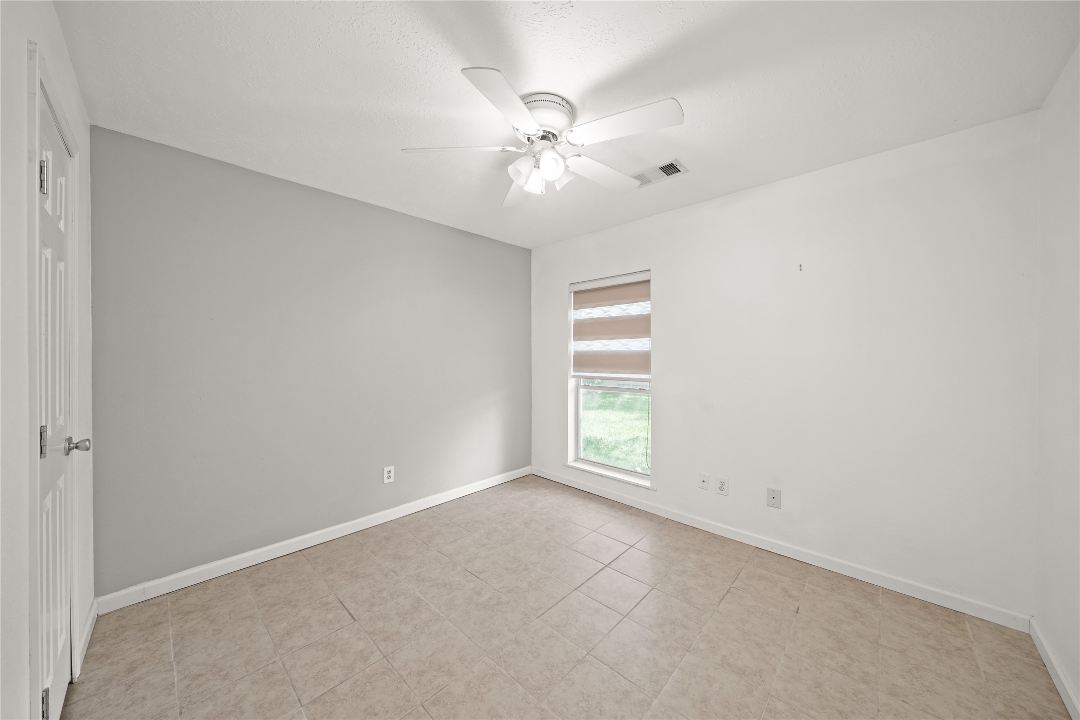 8134 Blue Jay Street Baytown, TX 77523 - Photo 24 of 31 a view of an empty room with a window