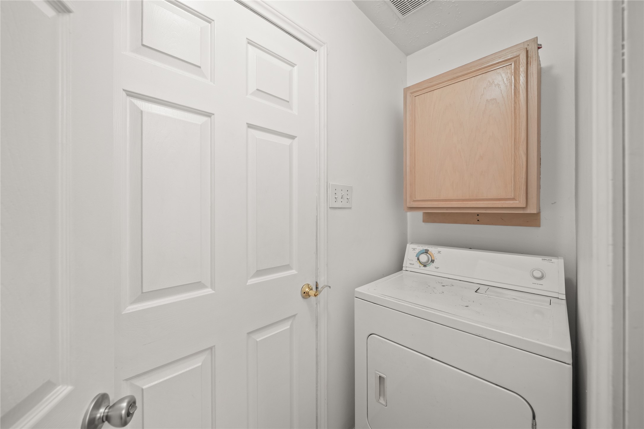 8134 Blue Jay Street Baytown, TX 77523 - Photo 26 of 31 a view of storage and utility room with washer and dryer