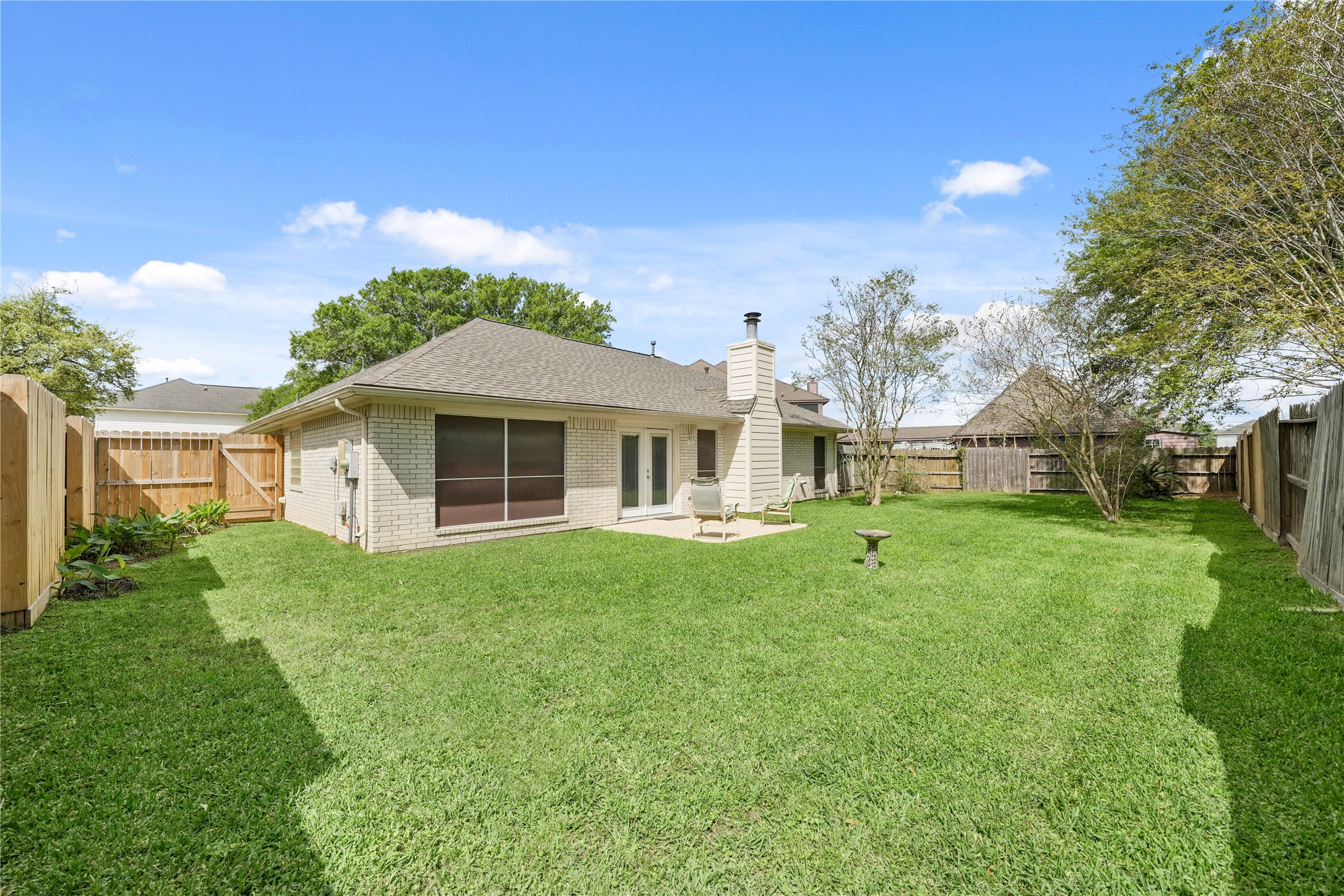 8134 Blue Jay Street Baytown, TX 77523 - Photo 28 of 31 a front view of a house with a yard