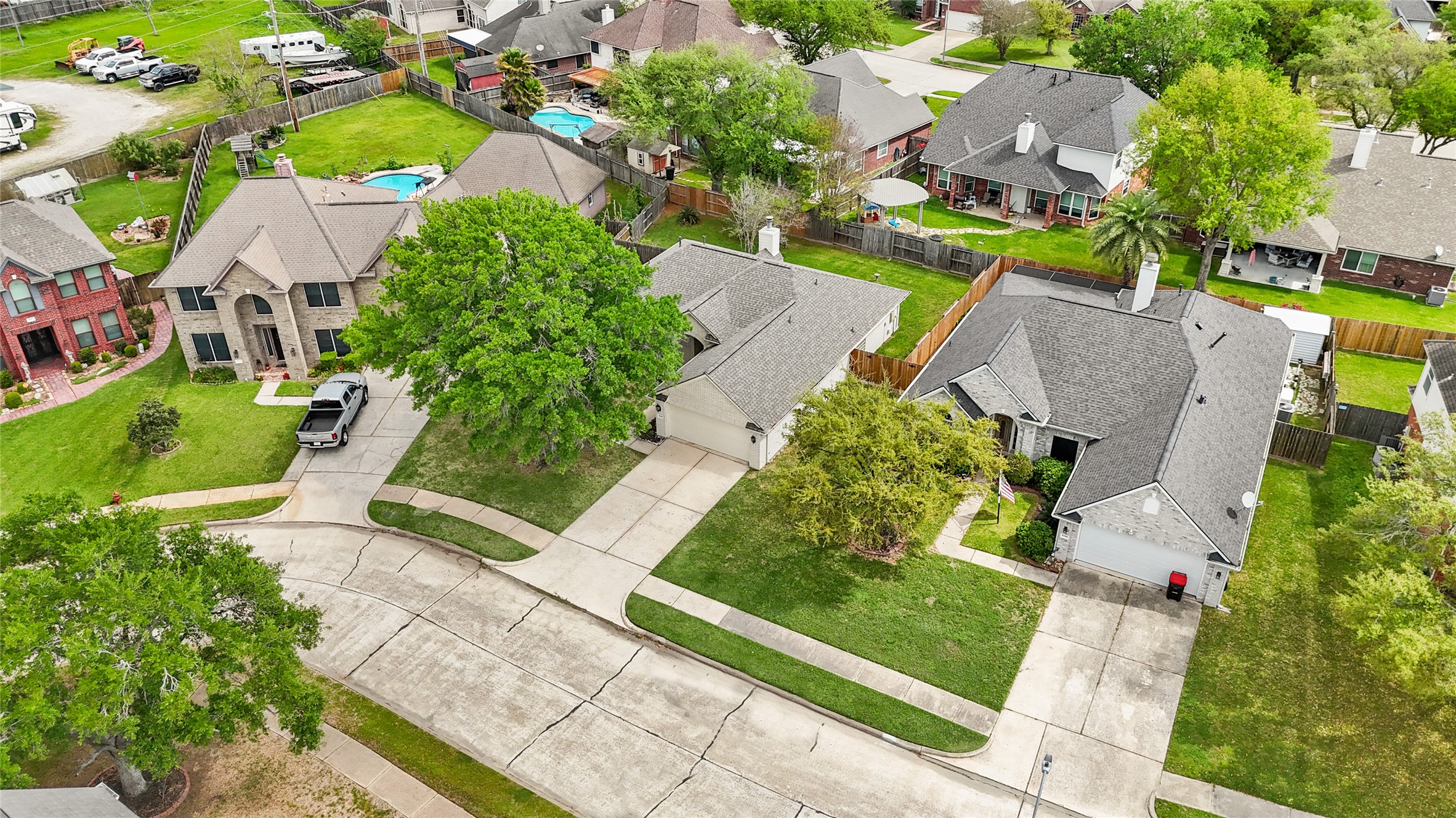 8134 Blue Jay Street Baytown, TX 77523 - Photo 29 of 31 an aerial view of a house with a garden and swimming pool