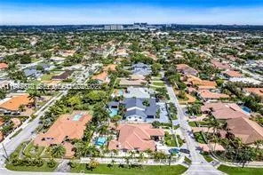 an aerial view of residential building and lake