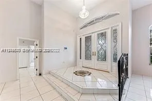 a bathroom with a tub shower and a sink