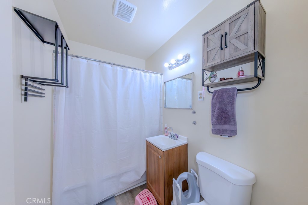 906 South Fann Street Anaheim, CA 92804 - Photo 10 of 27 a bathroom with a toilet and a shower