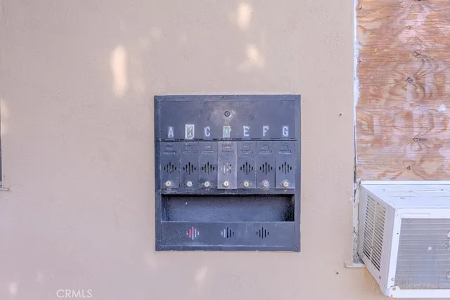 a view of a street with potted plants