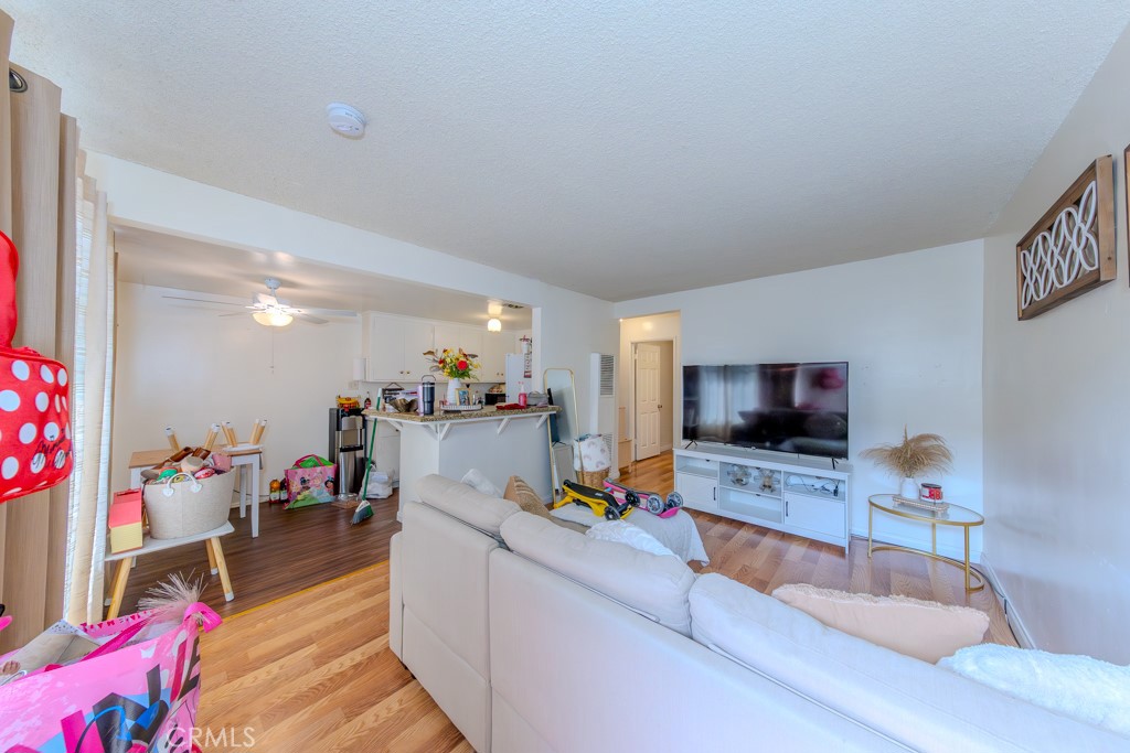 906 South Fann Street Anaheim, CA 92804 - Photo 3 of 27 a living room with furniture and a flat screen tv