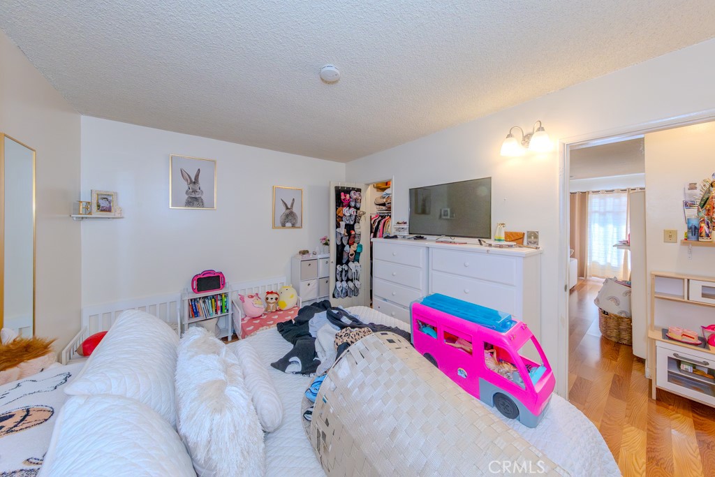 906 South Fann Street Anaheim, CA 92804 - Photo 6 of 27 a kids bedroom with a bed and a tv