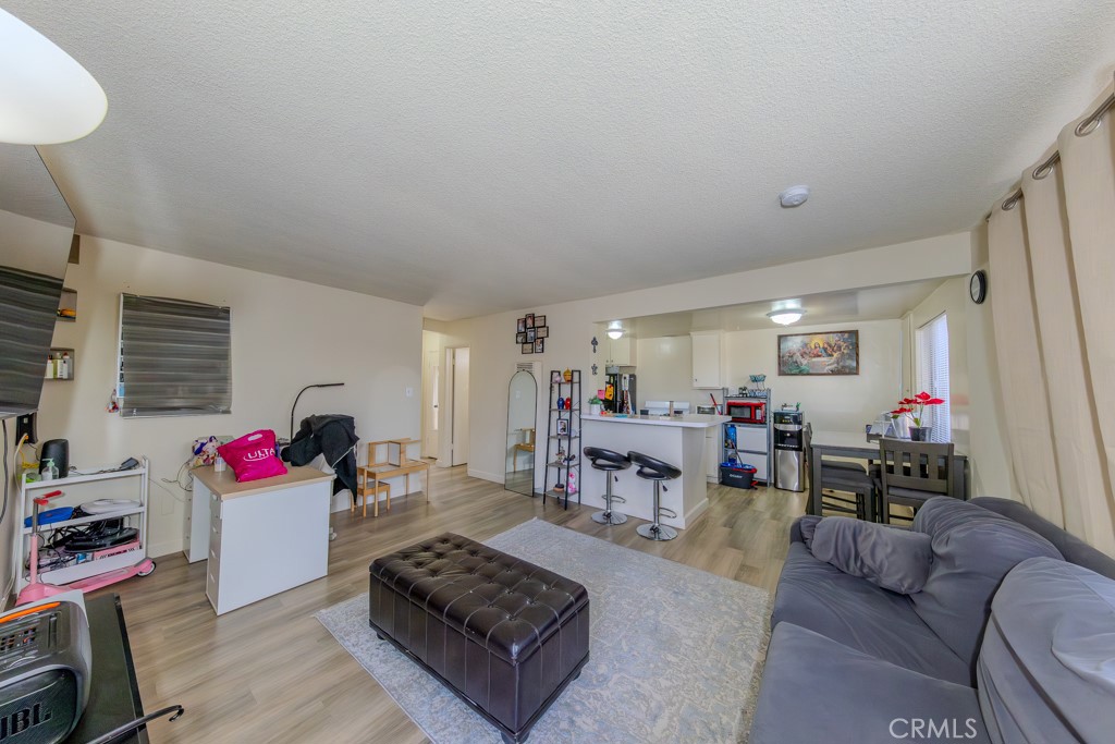906 South Fann Street Anaheim, CA 92804 - Photo 7 of 27 a living room with furniture and a flat screen tv