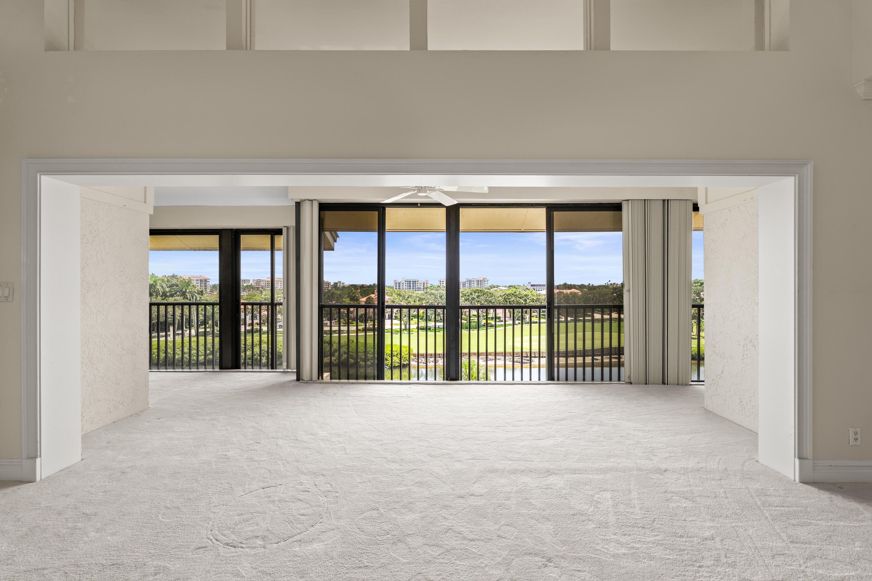 16940 Bay Street, Unit N504 Jupiter, FL 33477 - Photo 13 of 33 a view of an empty room with a balcony