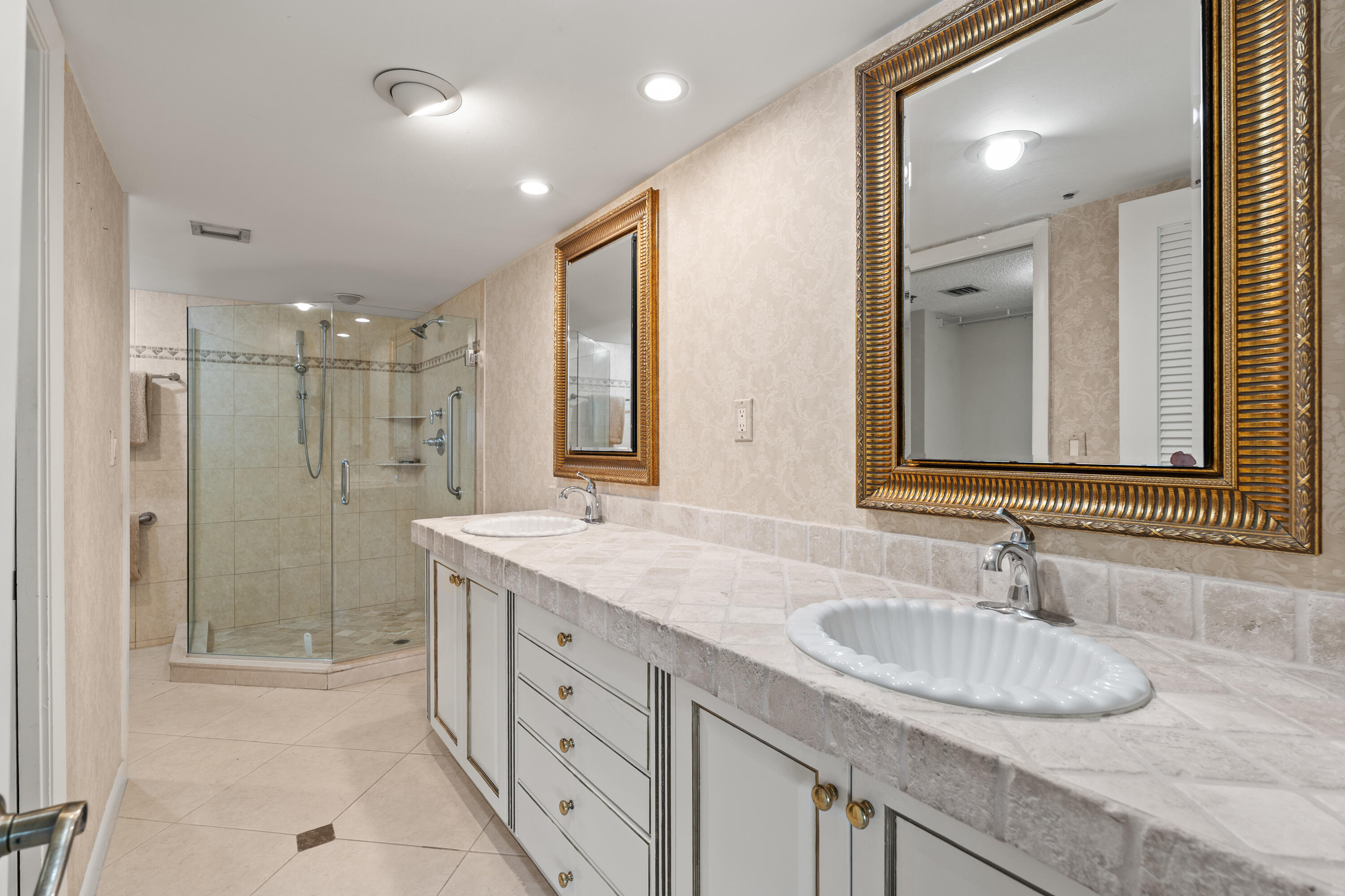 16940 Bay Street, Unit N504 Jupiter, FL 33477 - Photo 17 of 33 a bathroom with double sink and a mirror