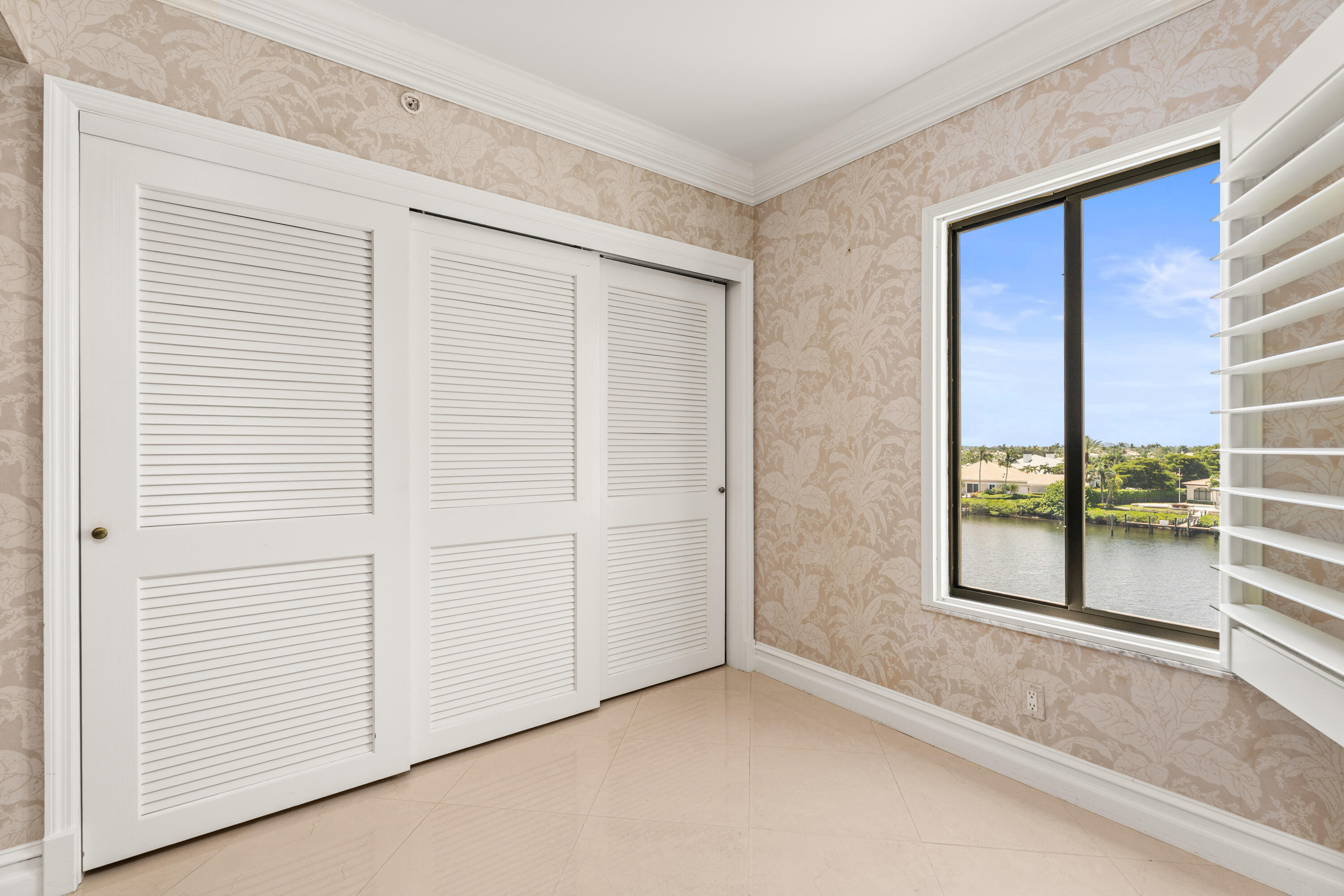 16940 Bay Street, Unit N504 Jupiter, FL 33477 - Photo 23 of 33 an empty room with windows