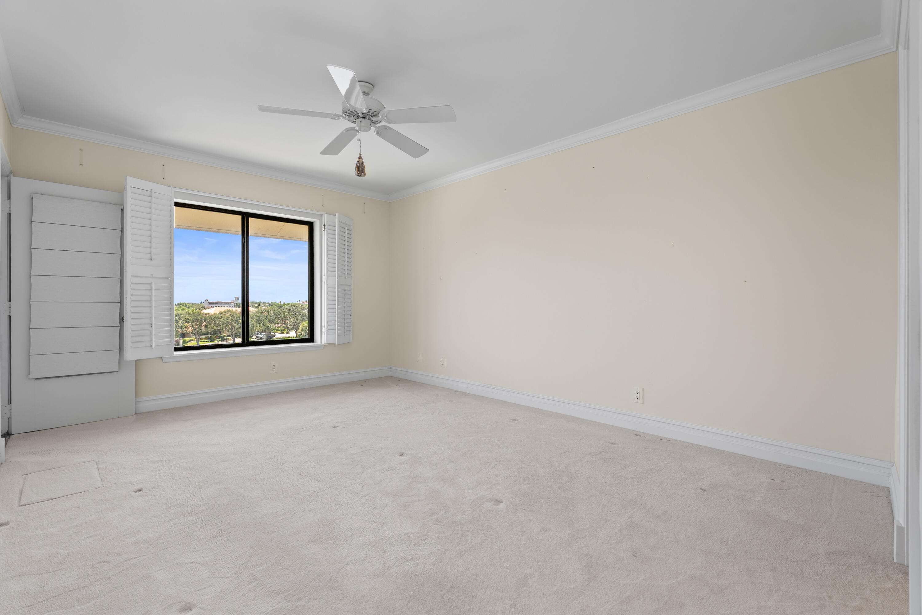 16940 Bay Street, Unit N504 Jupiter, FL 33477 - Photo 25 of 33 an empty room with windows and fan