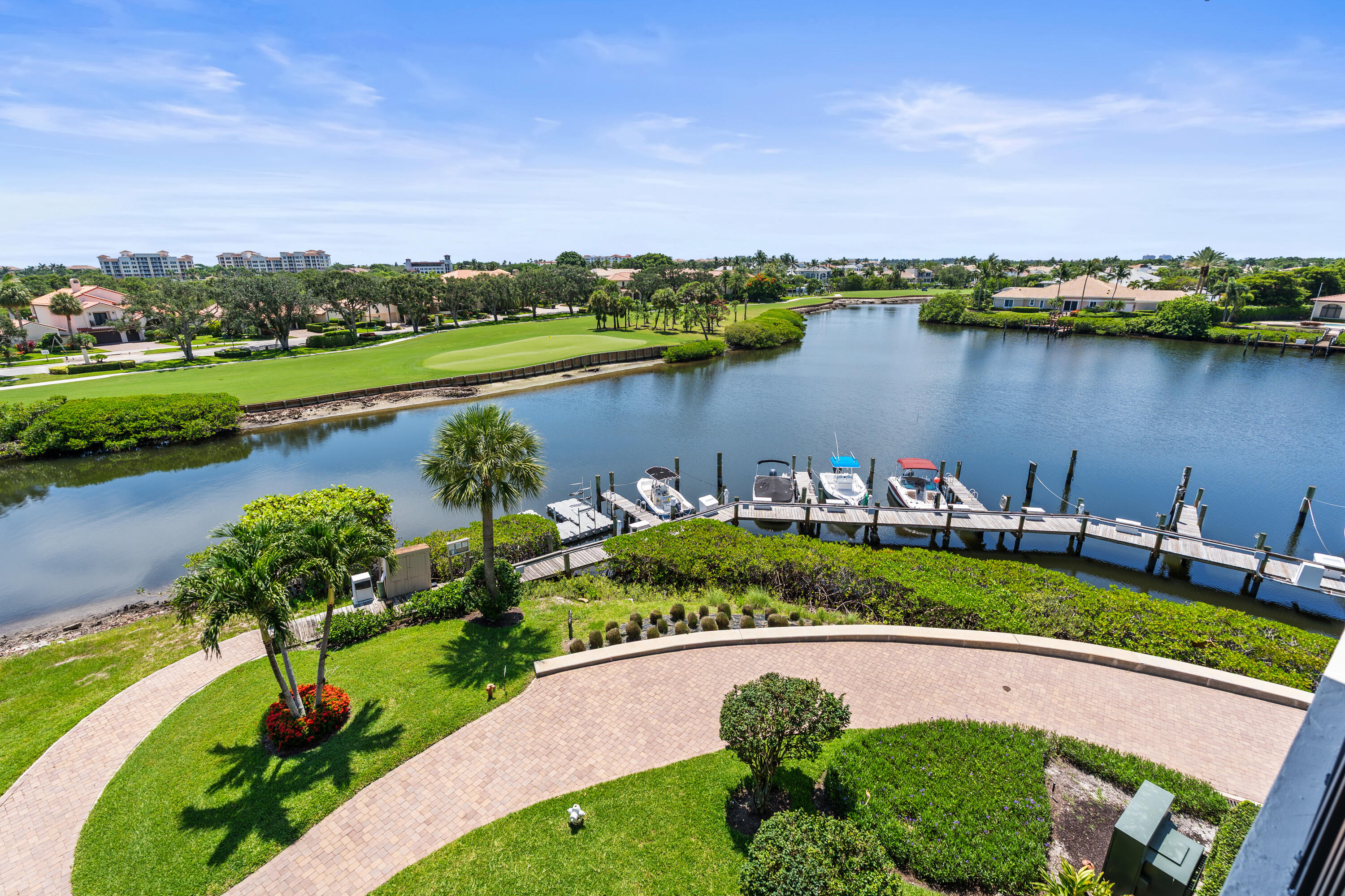 16940 Bay Street, Unit N504 Jupiter, FL 33477 - Photo 33 of 33 an aerial view of a house with a garden and lake view