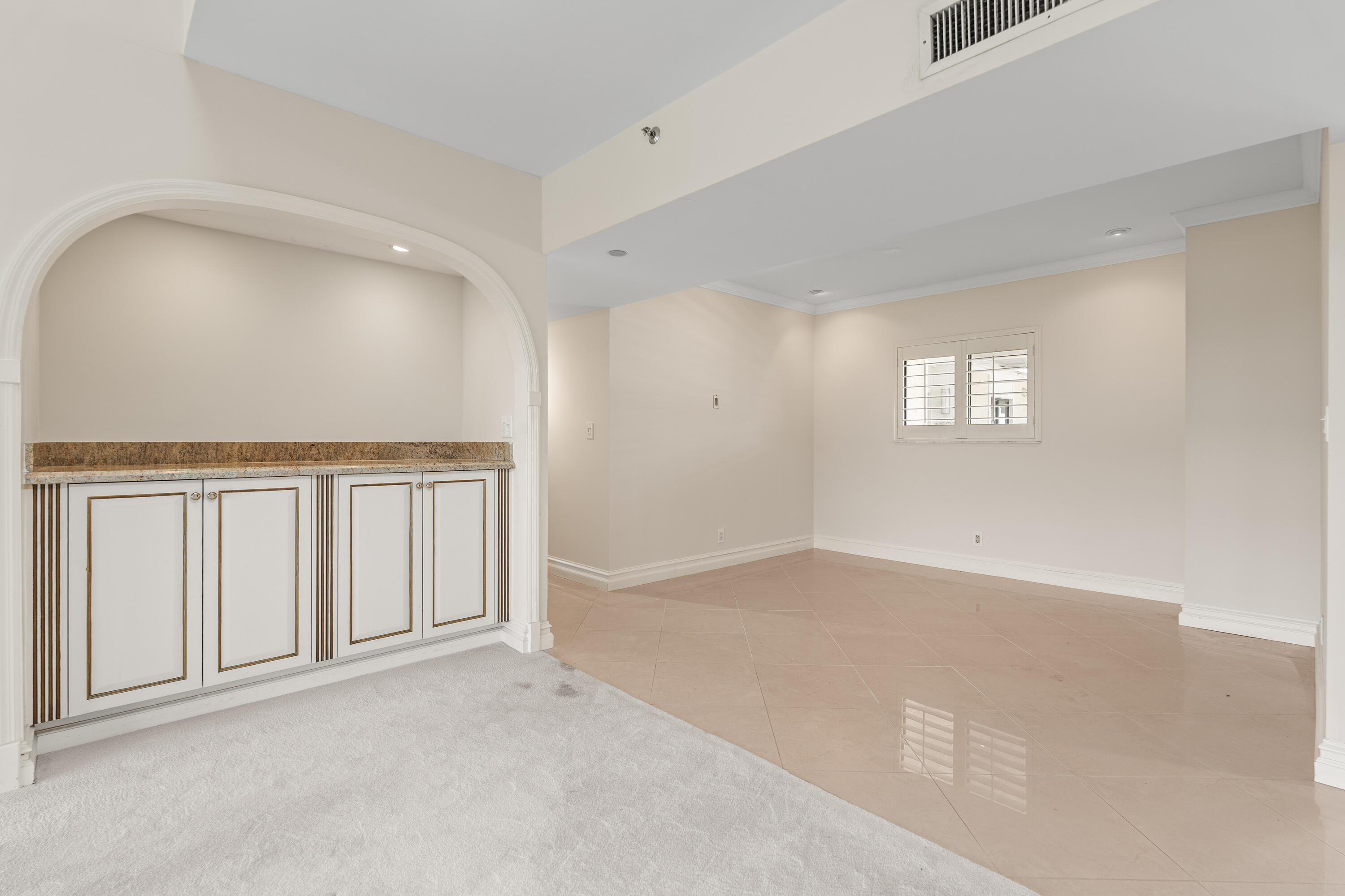 16940 Bay Street, Unit N504 Jupiter, FL 33477 - Photo 4 of 33 an empty room with windows