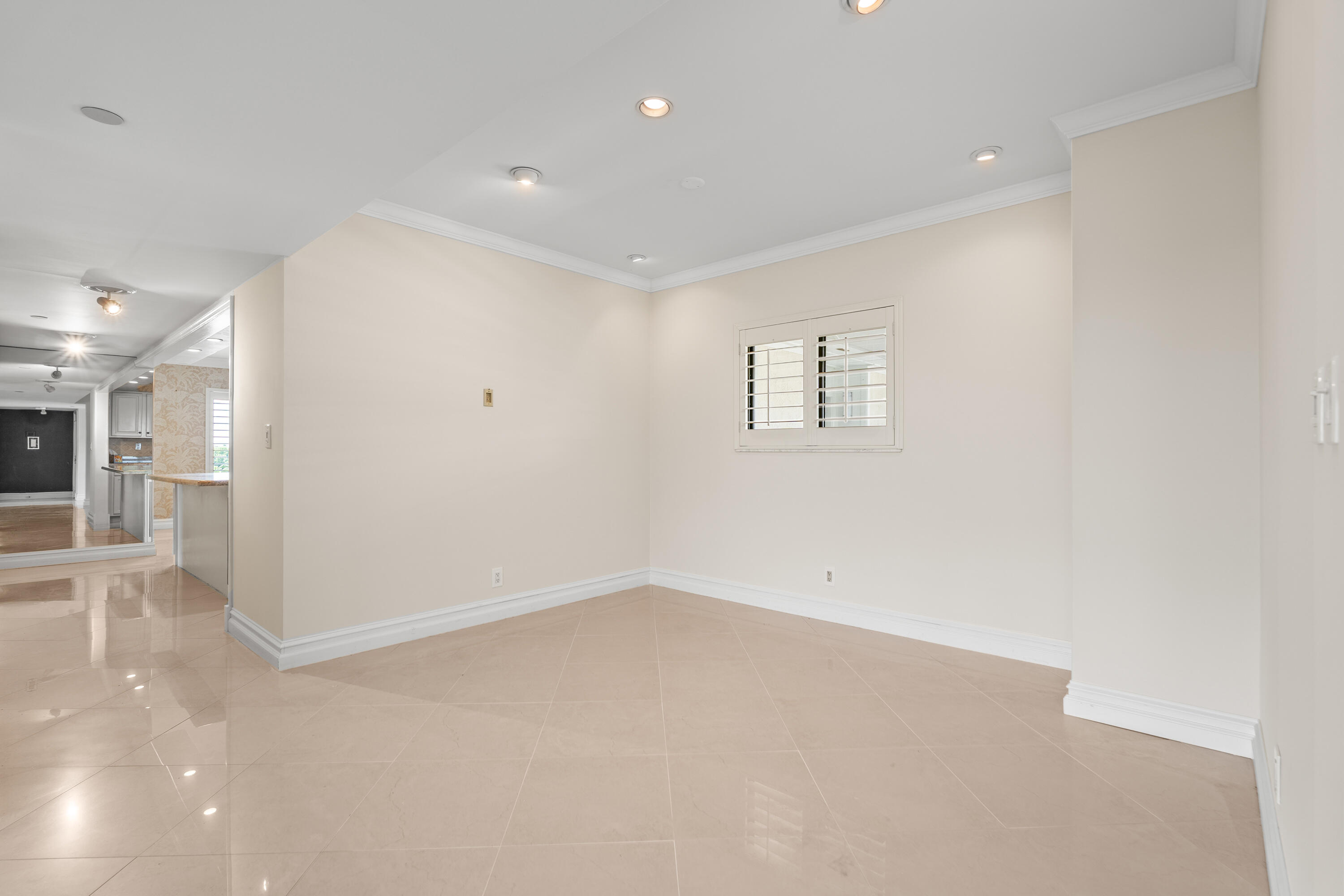 16940 Bay Street, Unit N504 Jupiter, FL 33477 - Photo 5 of 33 an empty room with entrance and windows