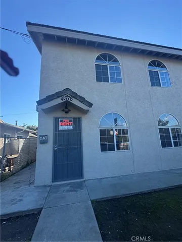a front view of a house with garage