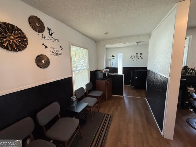 a workspace with furniture and wooden floor