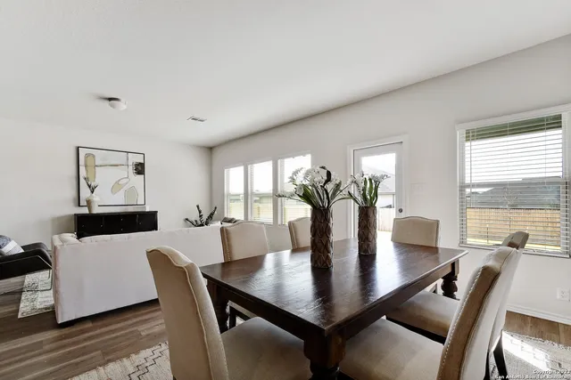 a view of staircase with wooden floor and white walls