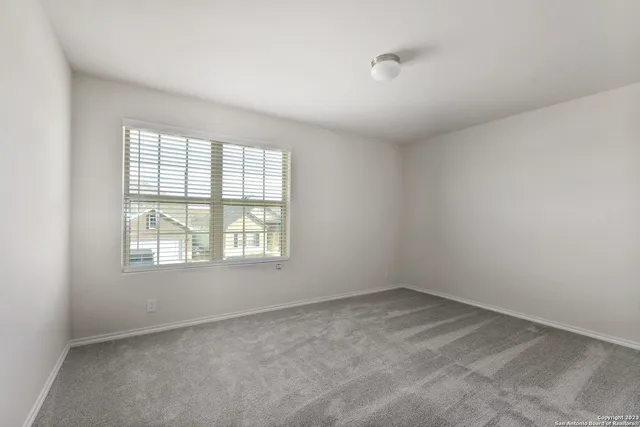 a bathroom with a double vanity sink toilet and shower