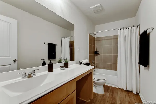 a backyard of a house with wooden fence