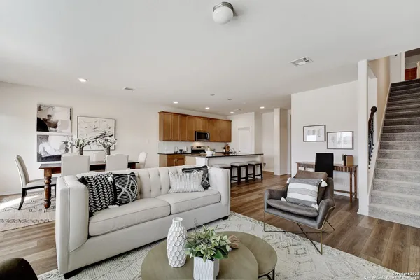 a living room with furniture or couch and a flat screen tv