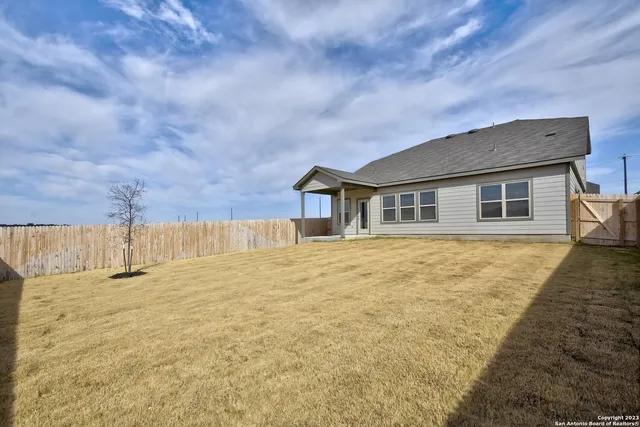 a view of a swimming pool with outdoor seating