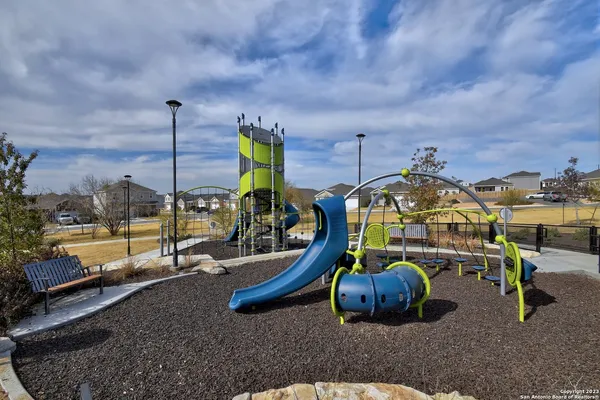a view of a park with a slide