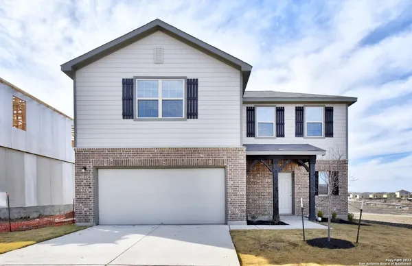a front view of a house with garage