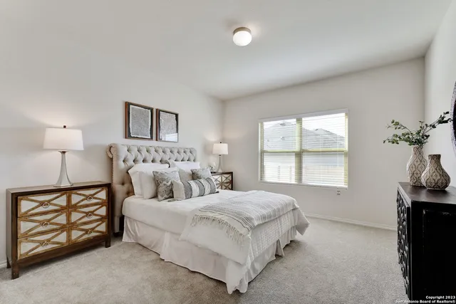 a bedroom with a bed and a tv