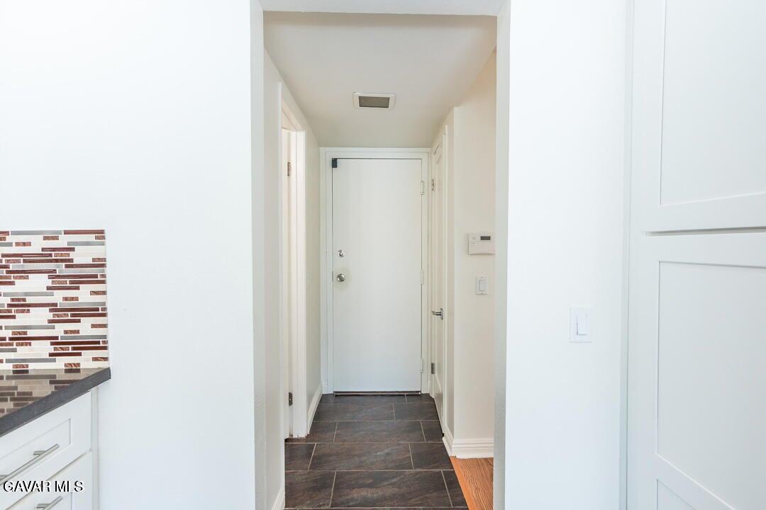 18452 Lemarsh Street, Unit 48 Northridge, CA 91325 - Photo 17 of 45 a view of a hallway with a wooden floor