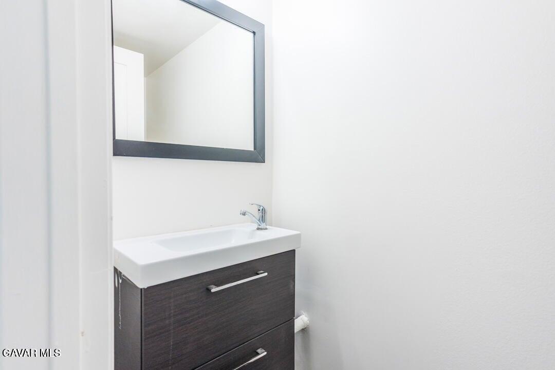 18452 Lemarsh Street, Unit 48 Northridge, CA 91325 - Photo 18 of 45 a bathroom with a sink and a mirror