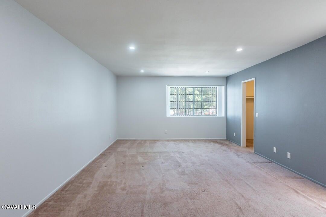 18452 Lemarsh Street, Unit 48 Northridge, CA 91325 - Photo 25 of 45 an empty room with windows