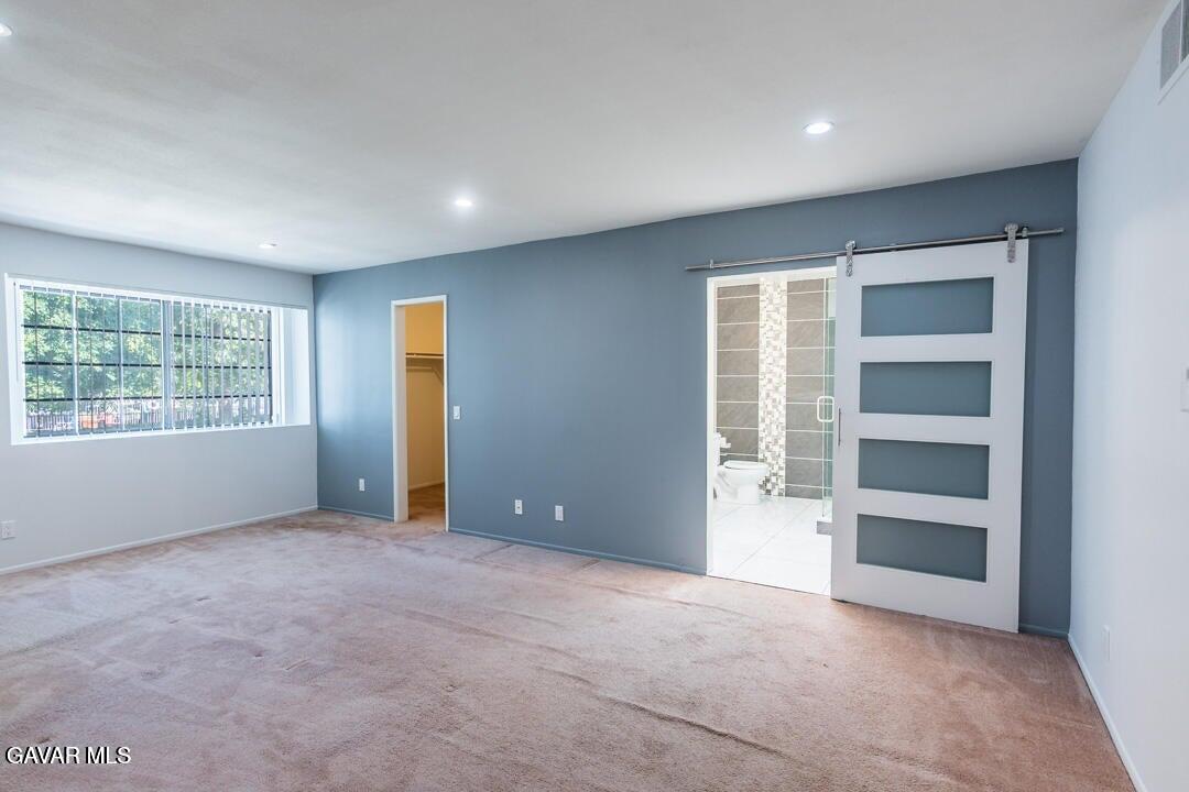 18452 Lemarsh Street, Unit 48 Northridge, CA 91325 - Photo 26 of 45 an empty room with a empty space and windows