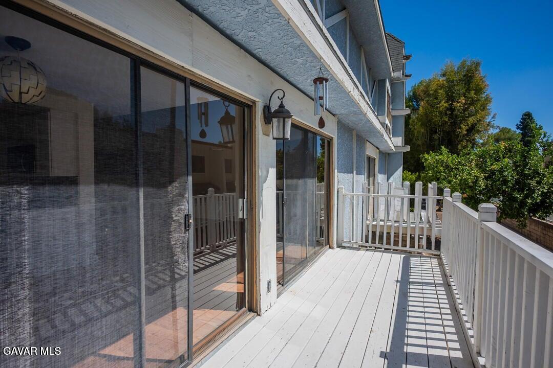 18452 Lemarsh Street, Unit 48 Northridge, CA 91325 - Photo 35 of 45 a view of a balcony with wooden floor