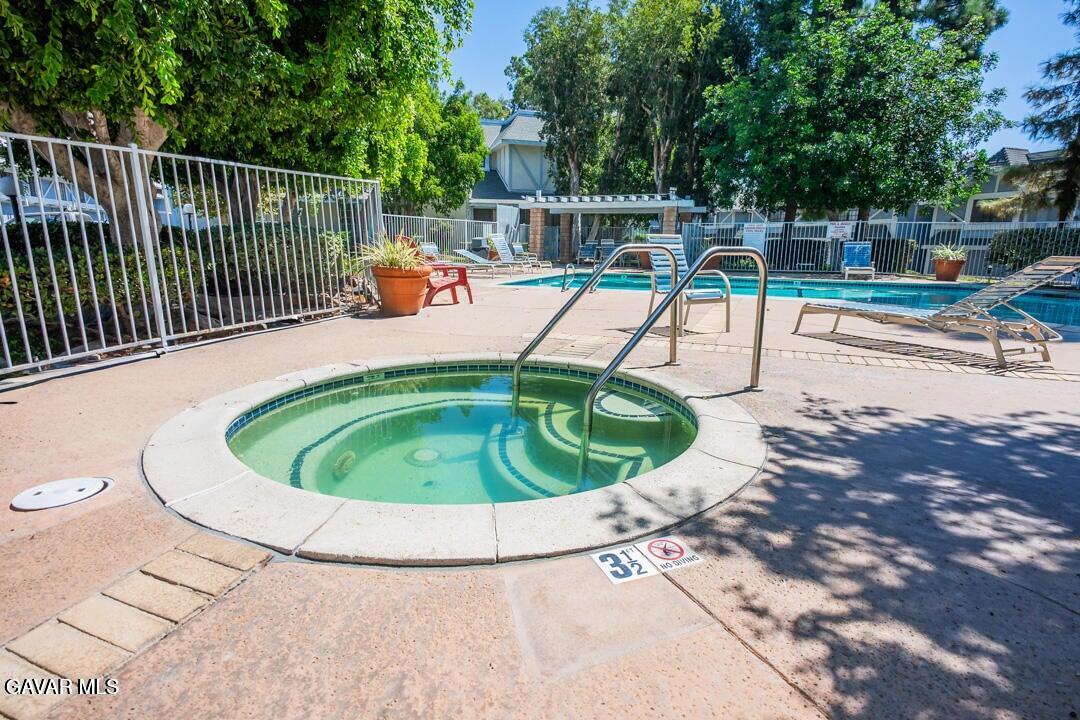 18452 Lemarsh Street, Unit 48 Northridge, CA 91325 - Photo 40 of 45 a small view of a swimming pool with a sitting space