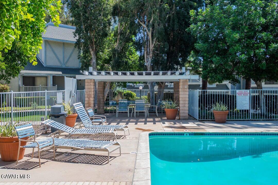 18452 Lemarsh Street, Unit 48 Northridge, CA 91325 - Photo 42 of 45 a view of a house with backyard sitting area and garden