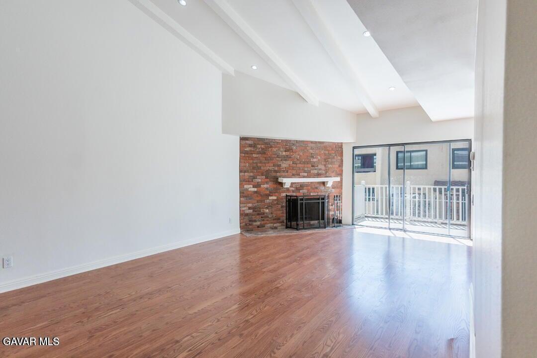 18452 Lemarsh Street, Unit 48 Northridge, CA 91325 - Photo 9 of 45 a view of a livingroom with wooden floor