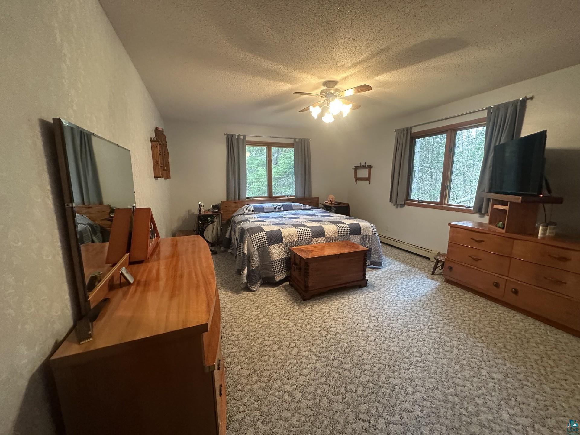 81 Hautaluoma Road Esko, MN 55733 - Photo 16 of 43 Spacious room featuring patterned carpeting and dual windows