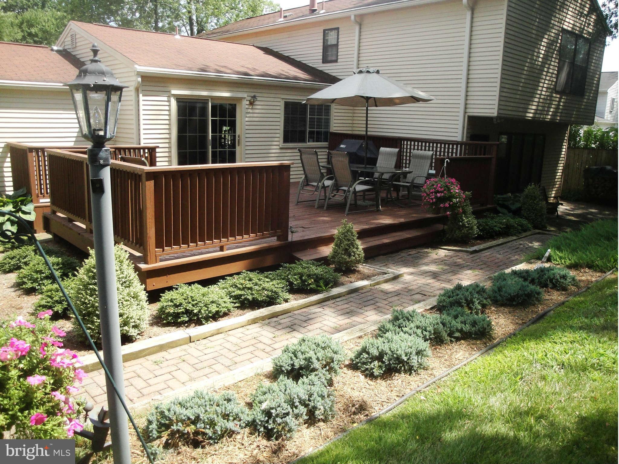 6406 Darwin Road Laurel, MD 20707 - Photo 17 of 22 a backyard of a house with yard fountain and outdoor seating