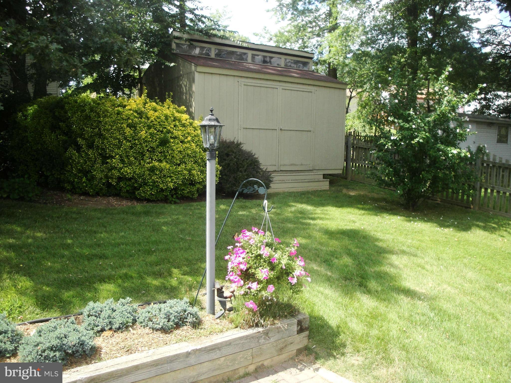 6406 Darwin Road Laurel, MD 20707 - Photo 20 of 22 a backyard of a house with lots of green space
