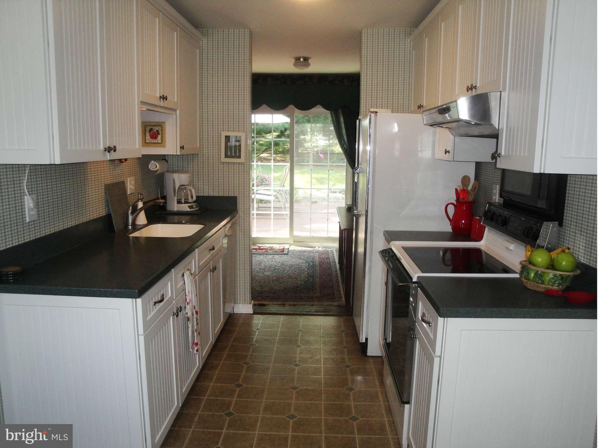 6406 Darwin Road Laurel, MD 20707 - Photo 3 of 22 a kitchen that has a sink and a stove