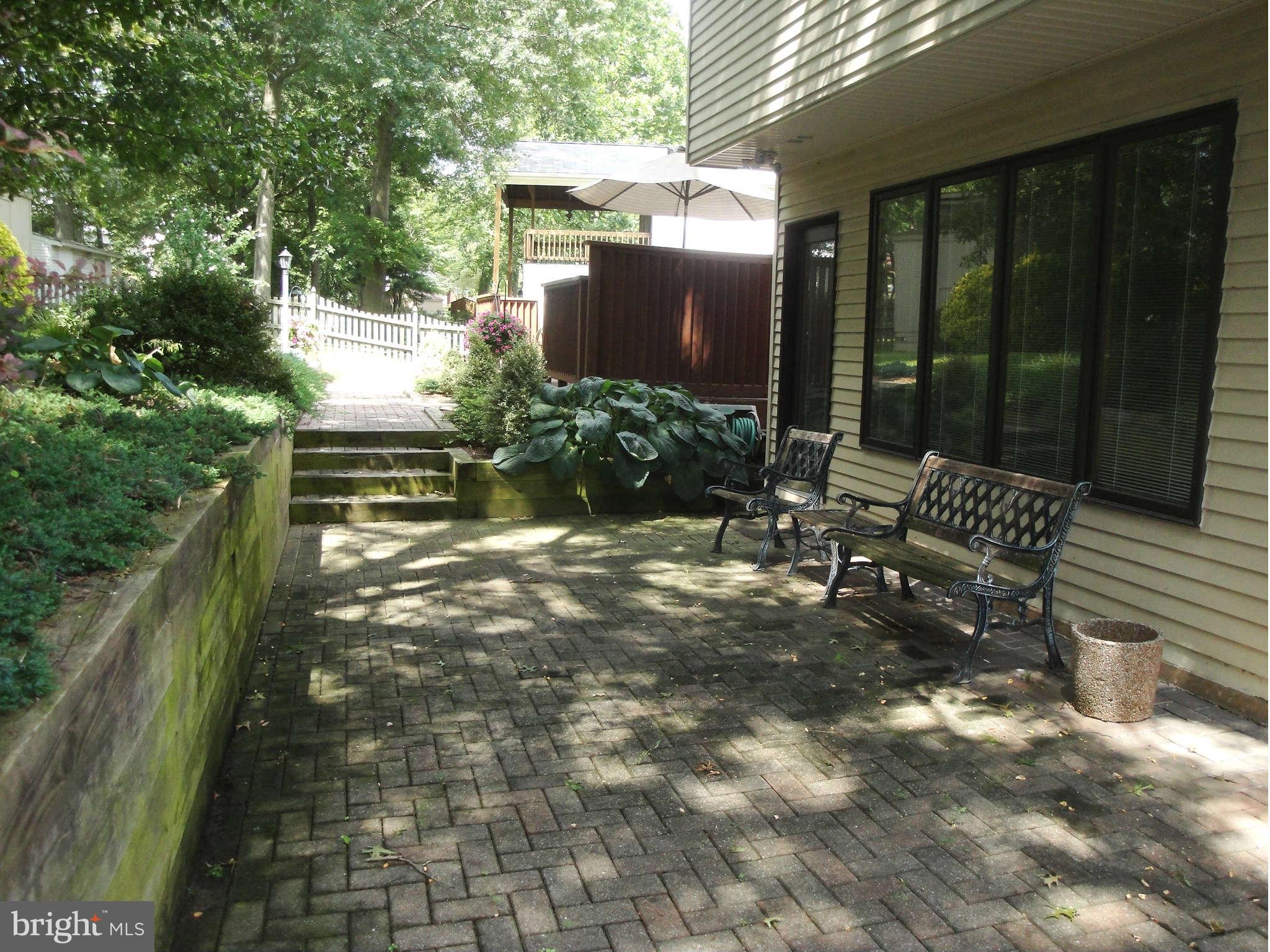 6406 Darwin Road Laurel, MD 20707 - Photo 21 of 22 a view of yard with patio