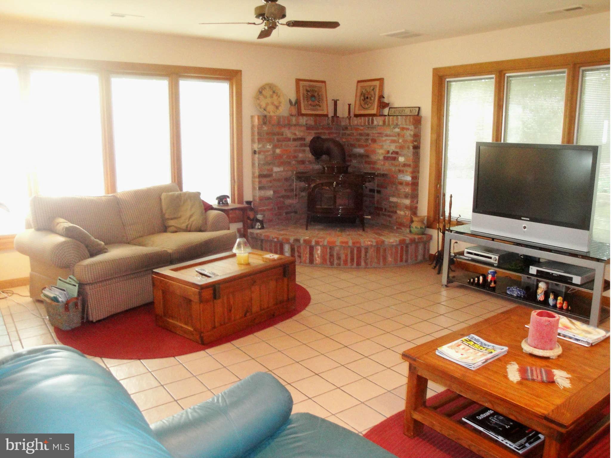6406 Darwin Road Laurel, MD 20707 - Photo 5 of 22 a living room with furniture and a flat screen tv